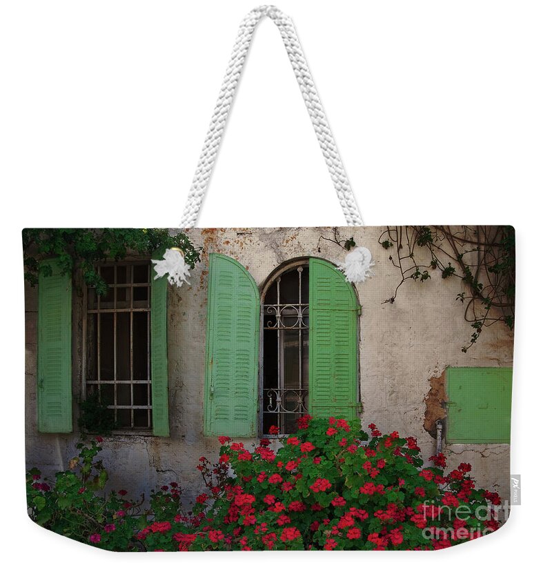 City Weekender Tote Bag featuring the photograph Green windows and red geranium flowers by Yair Karelic