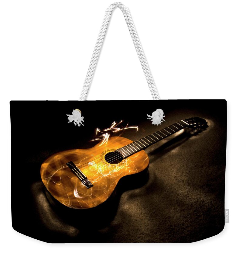 Guitar Weekender Tote Bag featuring the photograph Guitar, plucked by Karen Smale