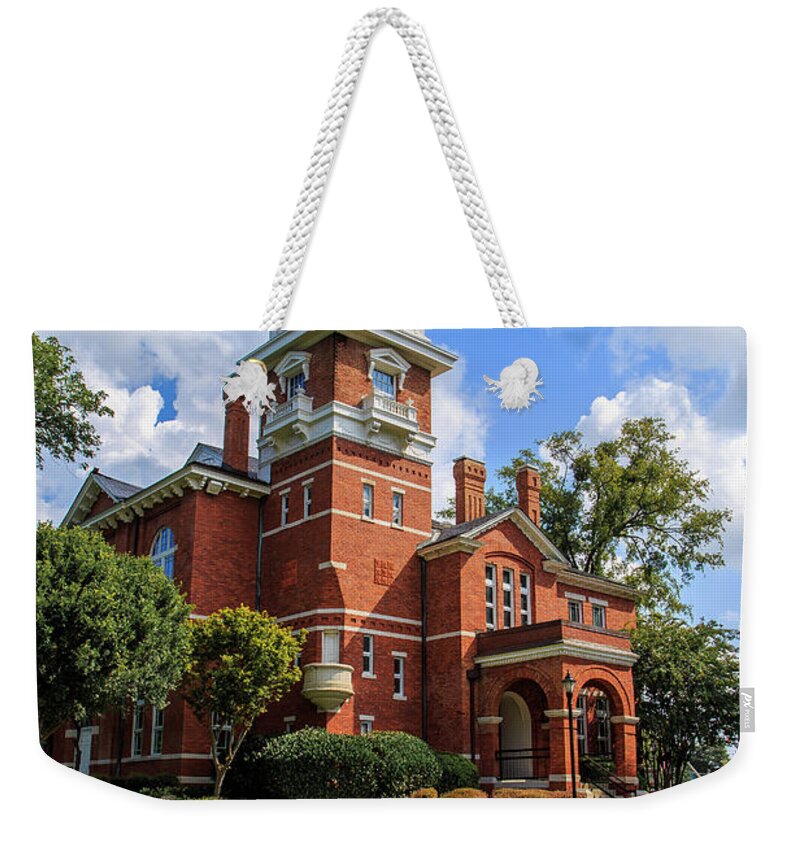 Lawrenceville Weekender Tote Bag featuring the photograph Gwinnett County Historic Courthouse by Doug Camara