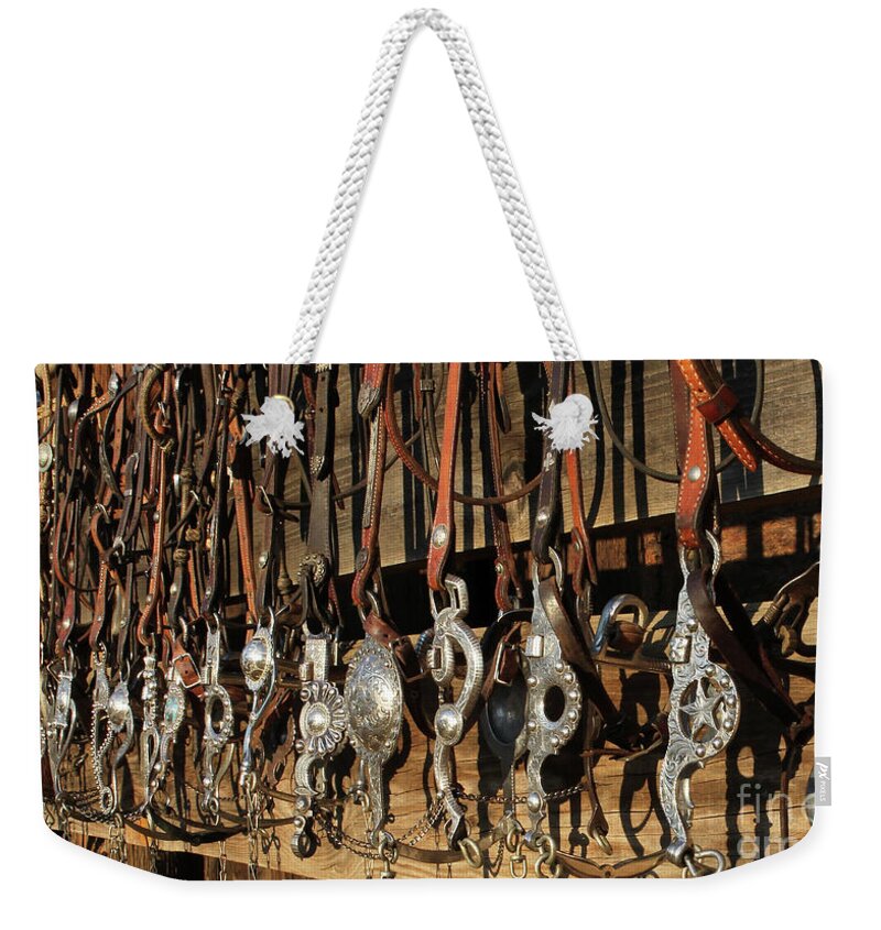 Cowboy Gear Weekender Tote Bag featuring the photograph Hanging Bits by Diane Bohna