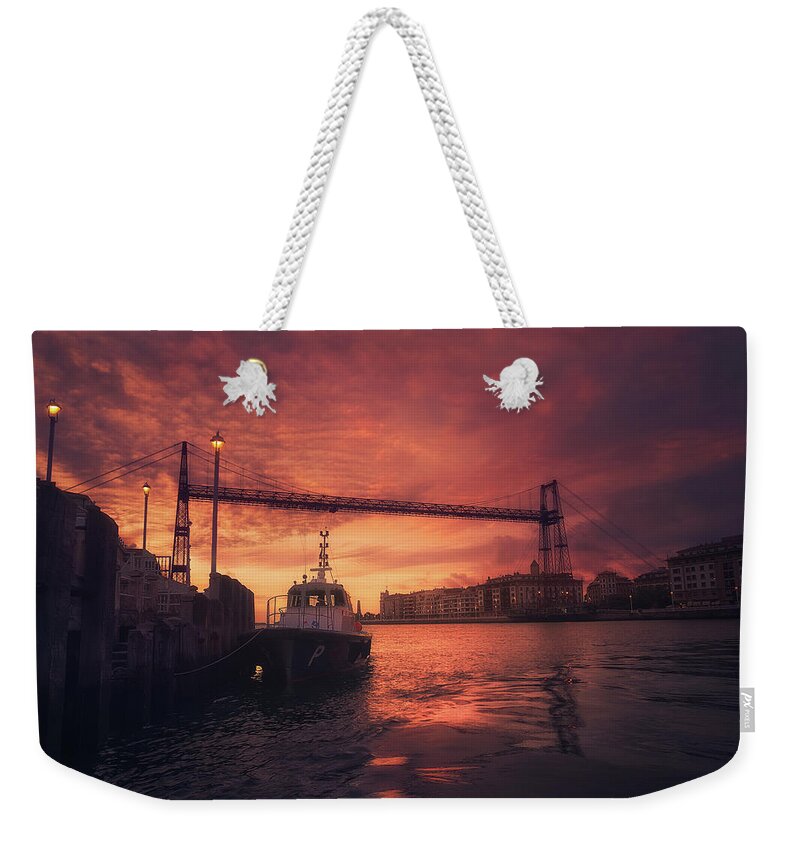 Hanging Weekender Tote Bag featuring the photograph Hanging Bridge Of Vizcaya At Sunset by Mikel Martinez de Osaba