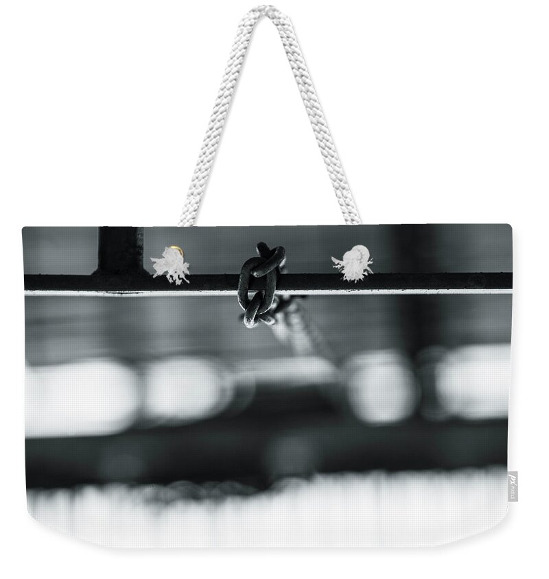 Chain Weekender Tote Bag featuring the photograph Hanging chain by Jason Hughes