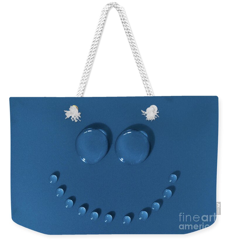 Face Weekender Tote Bag featuring the photograph Happy face made of water drops by Simon Bratt