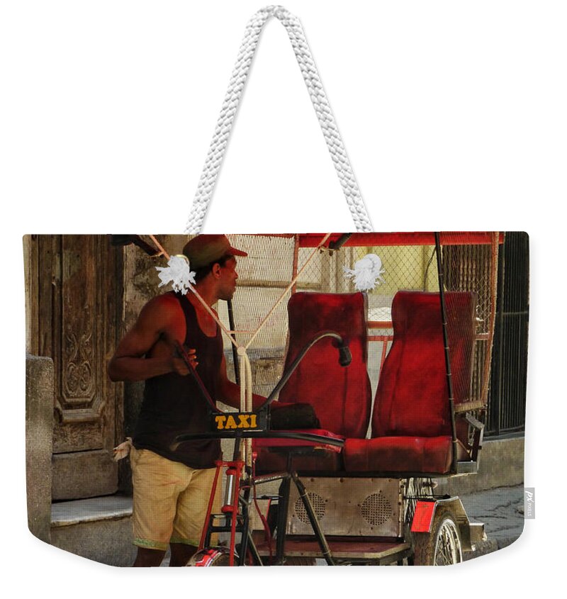 Connie Handscomb Weekender Tote Bag featuring the photograph He Works Hard For The Money by Connie Handscomb
