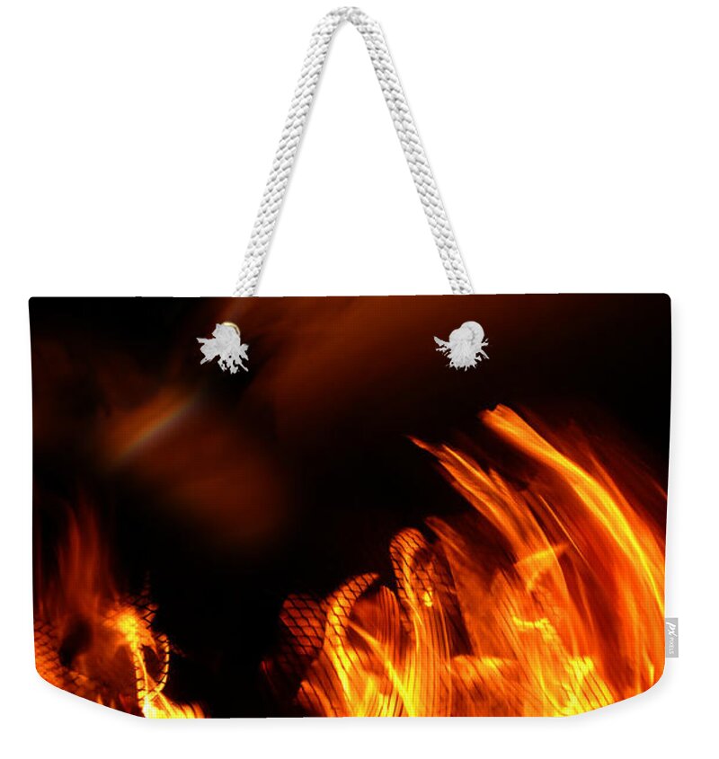 Fire Weekender Tote Bag featuring the photograph Heavenly Flame by Donna Blackhall
