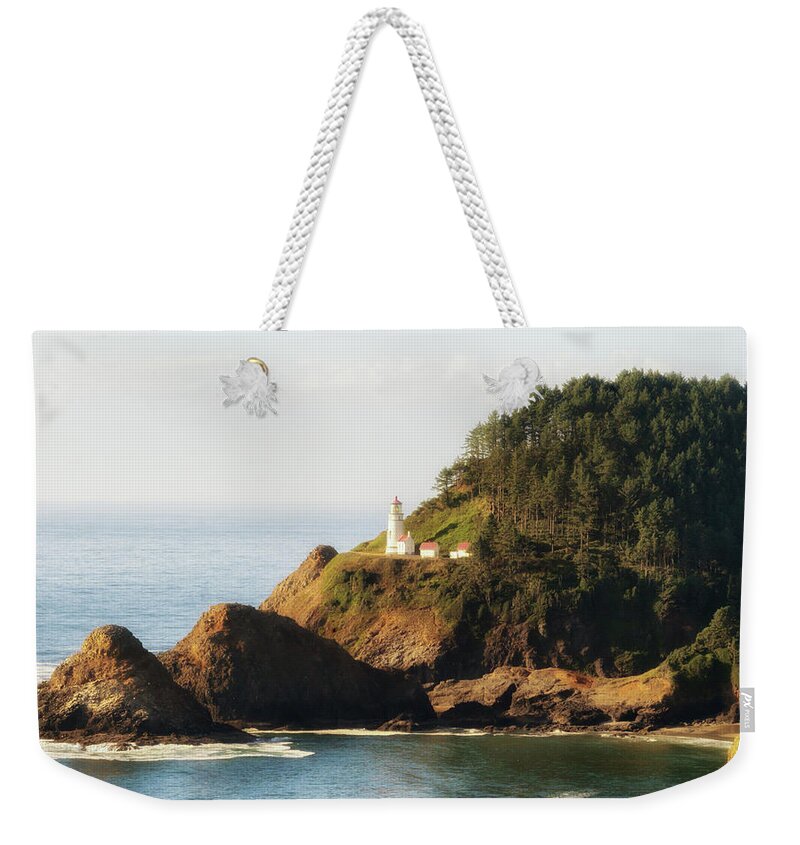 Rocks Weekender Tote Bag featuring the photograph Heceta Head Lighthouse by Michael Hope