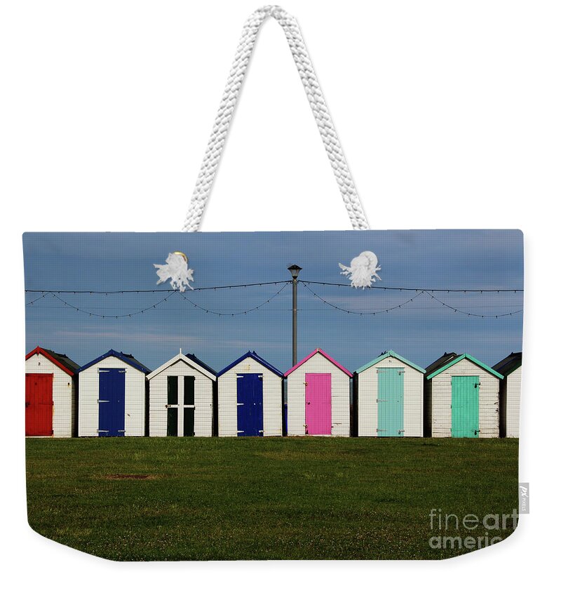 Beach Huts Weekender Tote Bag featuring the photograph Holiday beach huts by Tom Conway