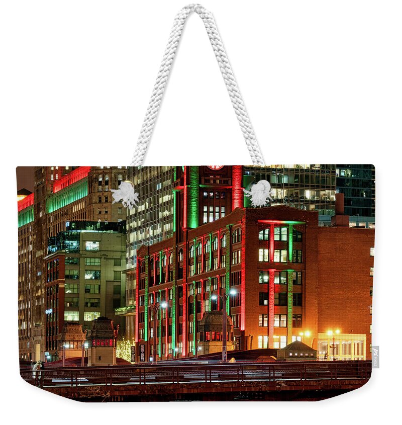 Chicago Weekender Tote Bag featuring the photograph Holiday colors along Chicago River by Izet Kapetanovic