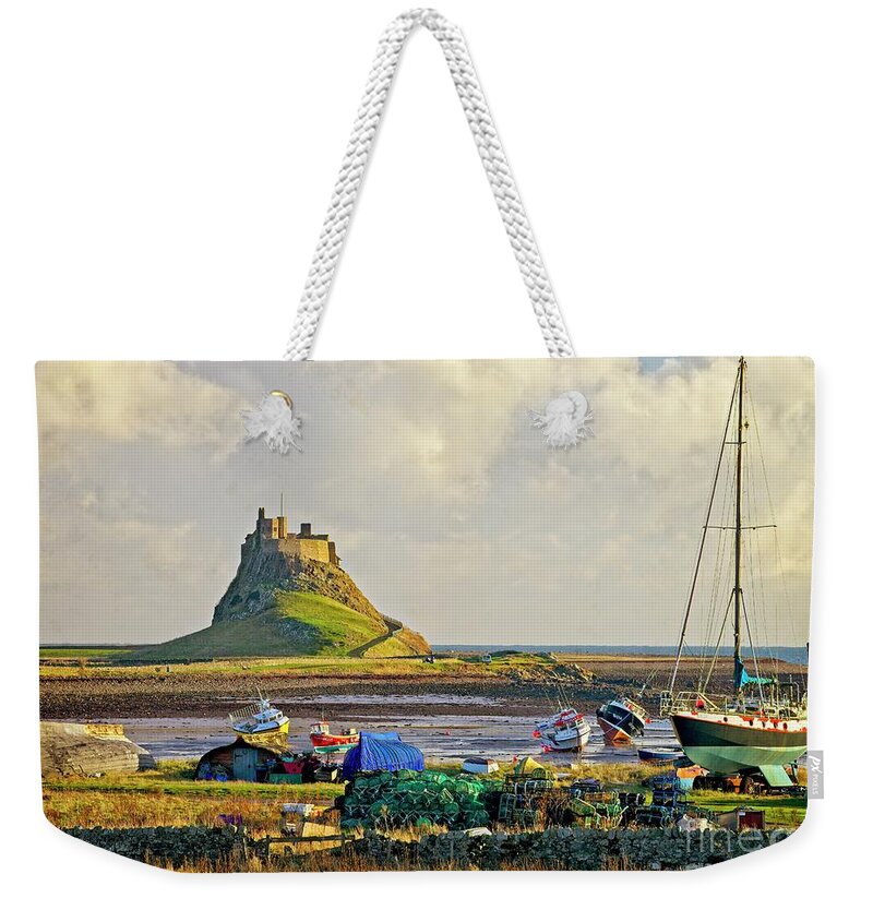 Lindisfarne Weekender Tote Bag featuring the photograph Holy Island and Lindisfarne Castle by Martyn Arnold
