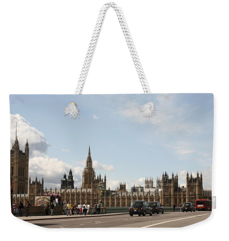 Big Weekender Tote Bag featuring the photograph Houses of parliament. by Christopher Rowlands