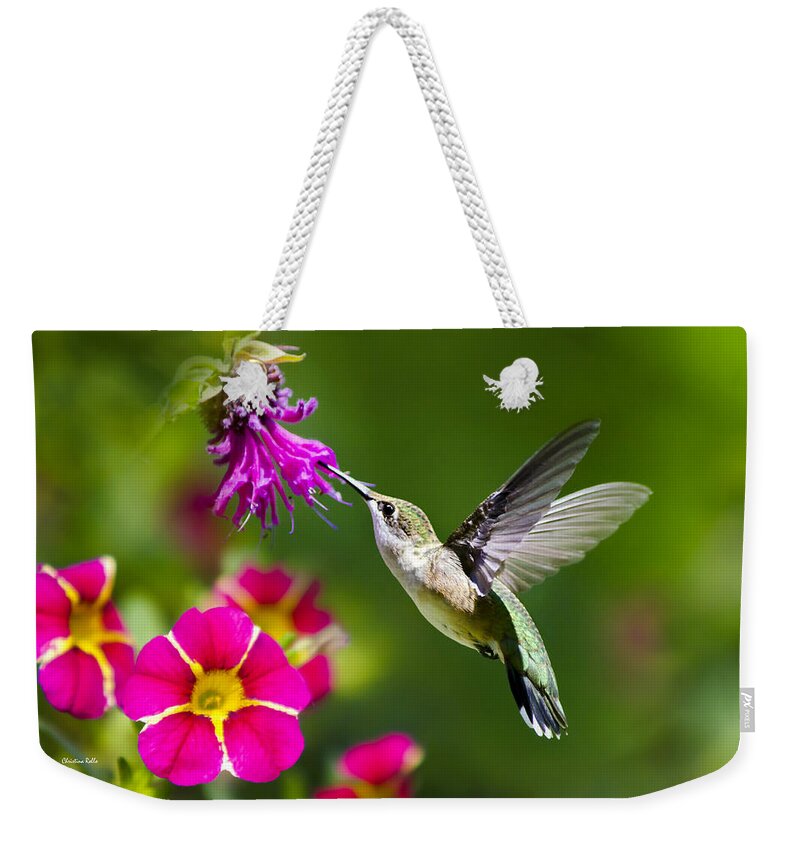 Hummingbird Weekender Tote Bag featuring the photograph Hummingbird with Flower by Christina Rollo