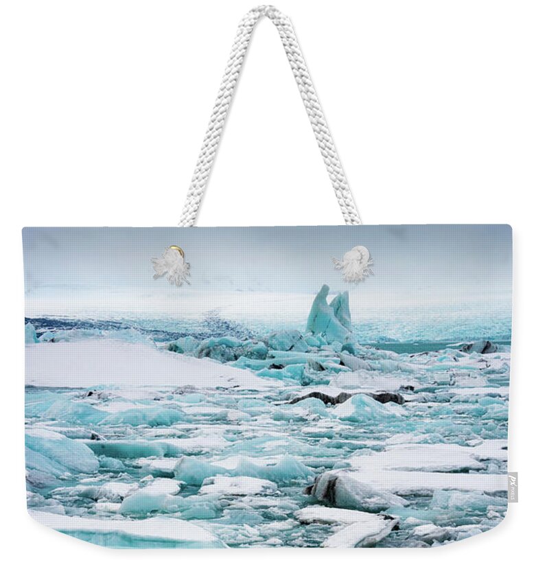 Ice Weekender Tote Bag featuring the photograph Ice galore in the Jokulsarlon Glacier Lagoon Iceland by Matthias Hauser
