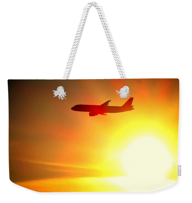 Boeing Weekender Tote Bag featuring the photograph In Flight by Olivier Le Queinec
