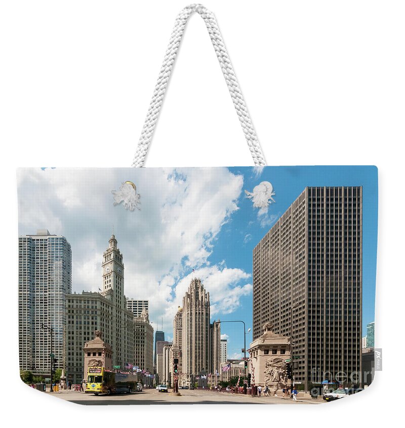 Chicago Weekender Tote Bag featuring the photograph In the Middle of Wacker and Michigan by David Levin