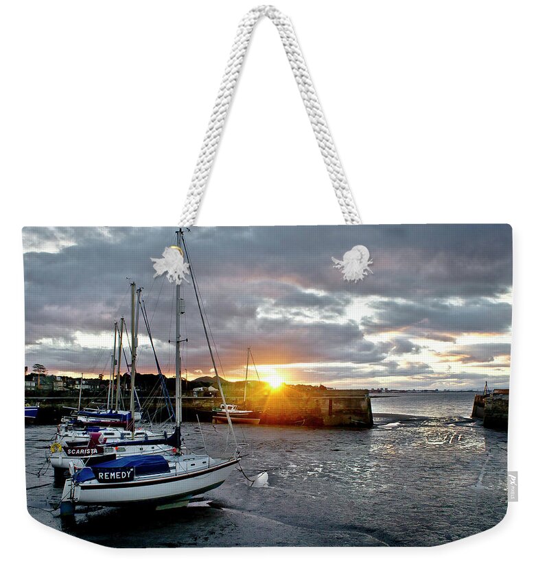 Sunset Weekender Tote Bag featuring the photograph In the rays of the setting sun. by Elena Perelman