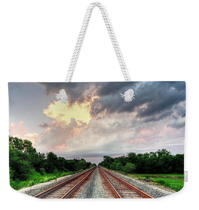 Multi Colored Clouds Weekender Tote Bag featuring the photograph Infinite Rail Tracks by Karen McKenzie McAdoo