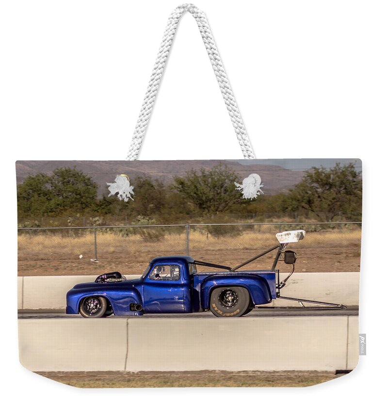 Ford Weekender Tote Bag featuring the photograph Insane Ford truck drag by Darrell Foster