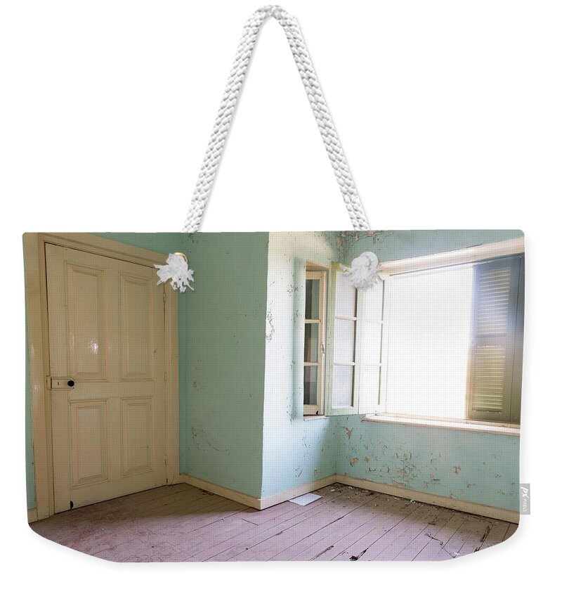Abandoned Weekender Tote Bag featuring the photograph Interior of a dirty abandoned room by Michalakis Ppalis