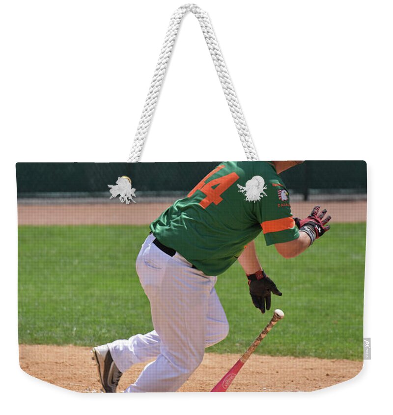 Sport Weekender Tote Bag featuring the photograph Isotopes Batter Takes Off by Mike Martin