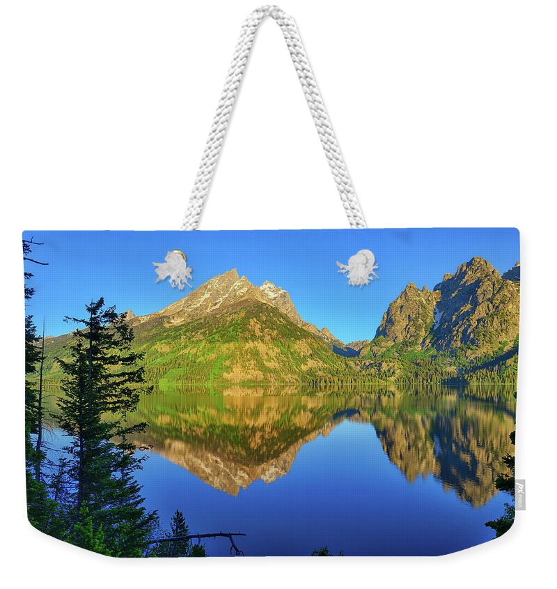 Jenny Lake Weekender Tote Bag featuring the photograph Jenny Lake Morning Reflections by Greg Norrell