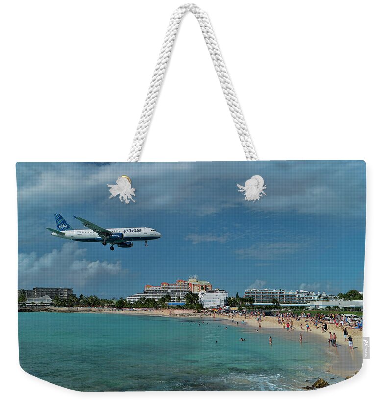 Jetblue Weekender Tote Bag featuring the photograph jetBlue landing at SXM airport. by David Gleeson