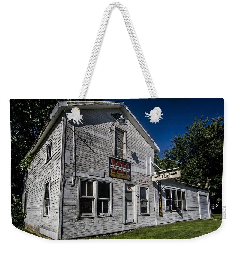 Johnny's Garage Weekender Tote Bag featuring the photograph Johnny's Garage in late afternoon sun by Sven Brogren