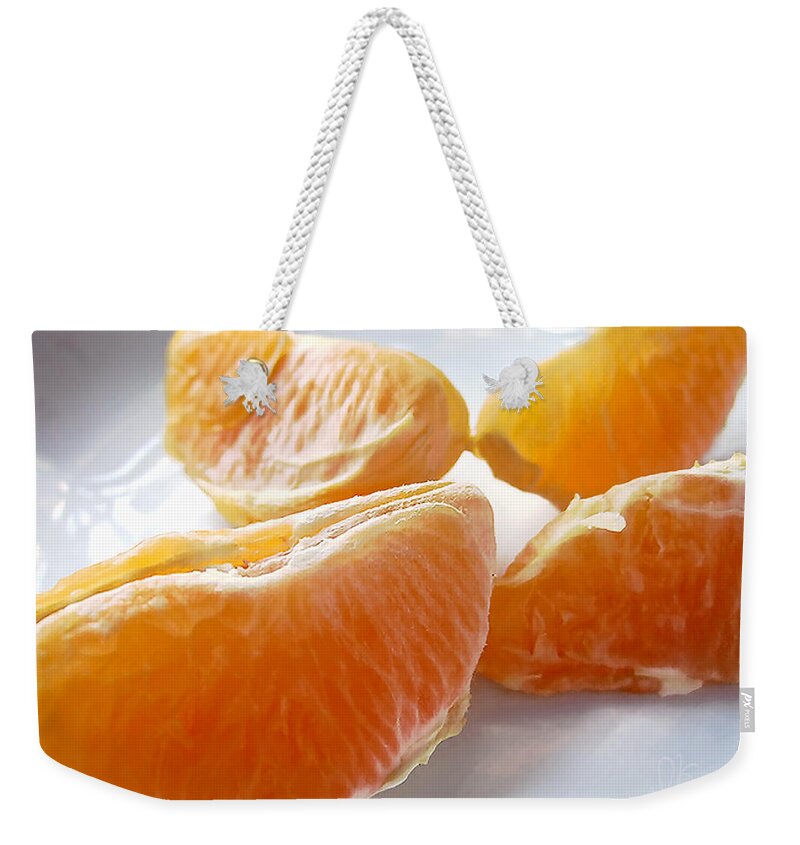 Orange Weekender Tote Bag featuring the photograph Juicy Orange Slices on a Blue Glass Plate by Louise Kumpf