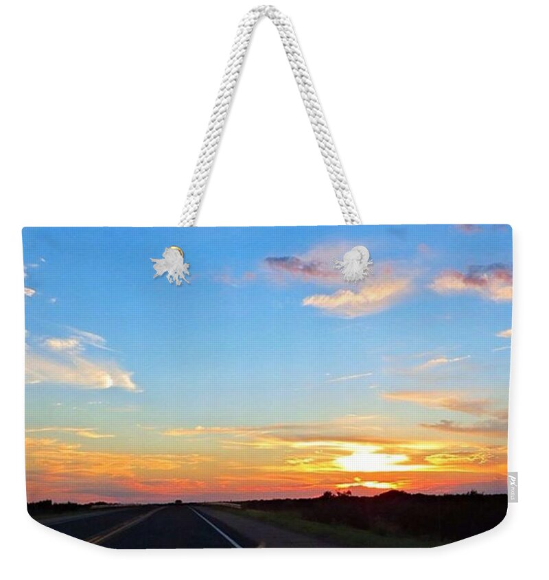 Sunrise_and_sunsets Weekender Tote Bag featuring the photograph Just Riding Into The by Austin Tuxedo Cat