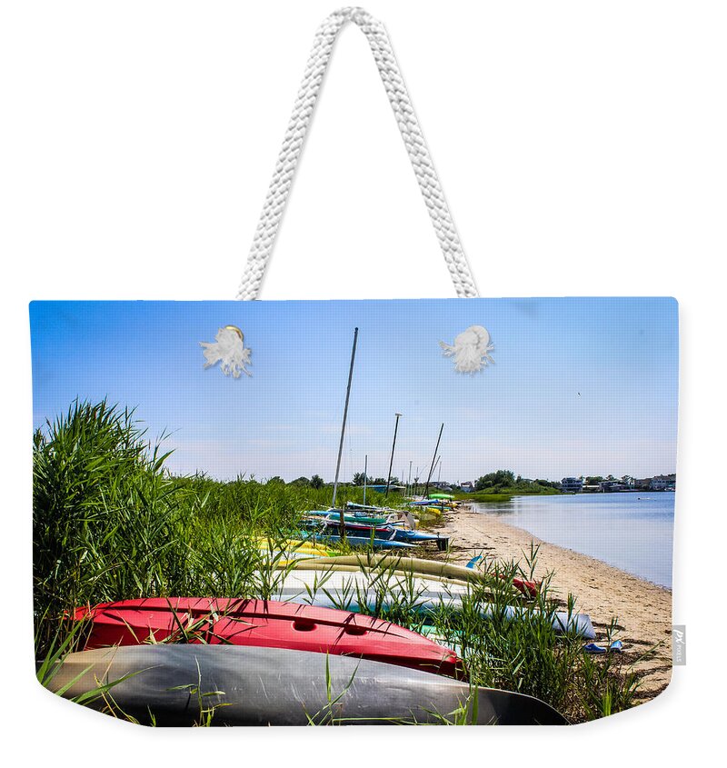 Kayaks Weekender Tote Bag featuring the photograph Kayaks on the Beach by Colleen Kammerer