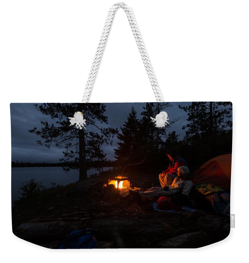 Boundary Waters Weekender Tote Bag featuring the photograph Keeping Warm by Paul Schultz
