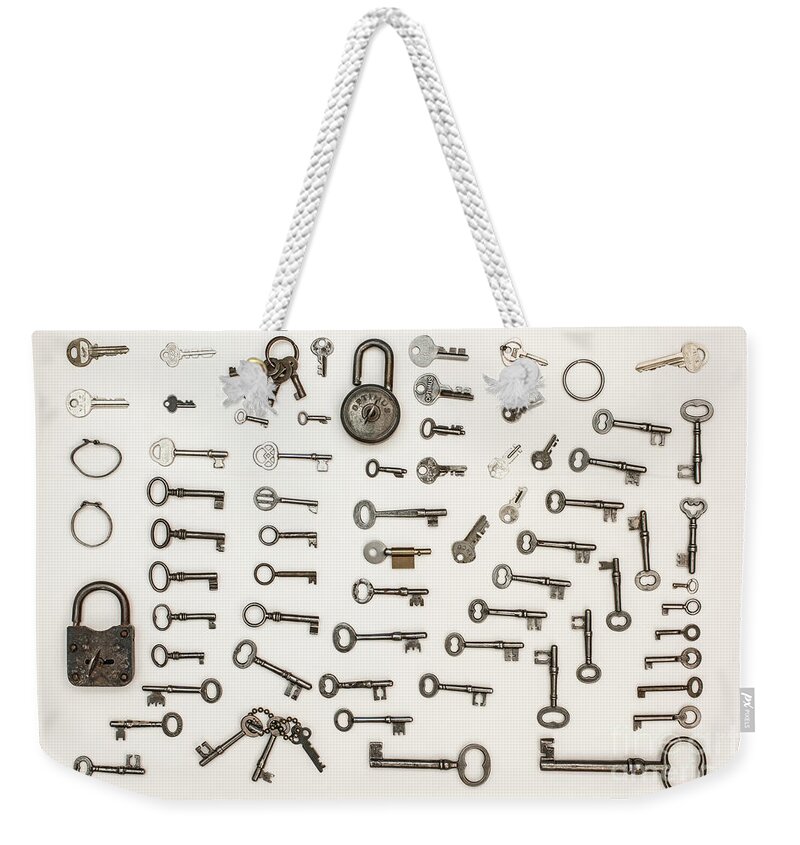 Old Keys Weekender Tote Bag featuring the photograph Key's by Torbjorn Swenelius