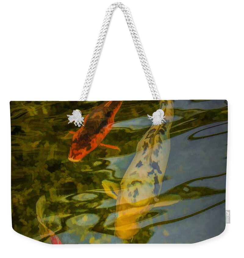 Art Weekender Tote Bag featuring the photograph Koi Fish swimming underneath the Reflections in a Pond by Randall Nyhof