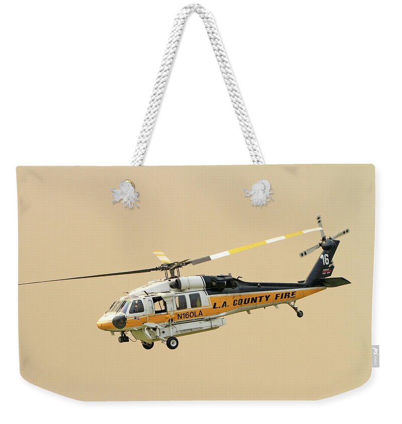 Erickson Sky Crane Weekender Tote Bag featuring the photograph La Tuna Fire 34 by Shoal Hollingsworth