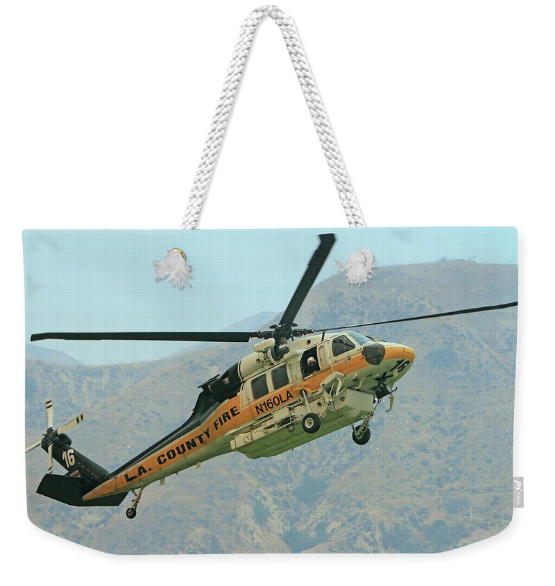 Erickson Sky Crane Weekender Tote Bag featuring the photograph La Tuna Fire 63 by Shoal Hollingsworth