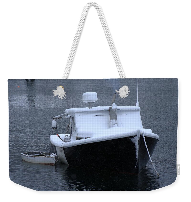 Seascape Weekender Tote Bag featuring the photograph Laboat In The Snow by Doug Mills