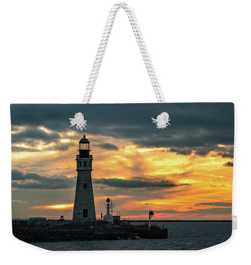 Sunset Weekender Tote Bag featuring the photograph Lake Erie Lighthouse by Dave Niedbala