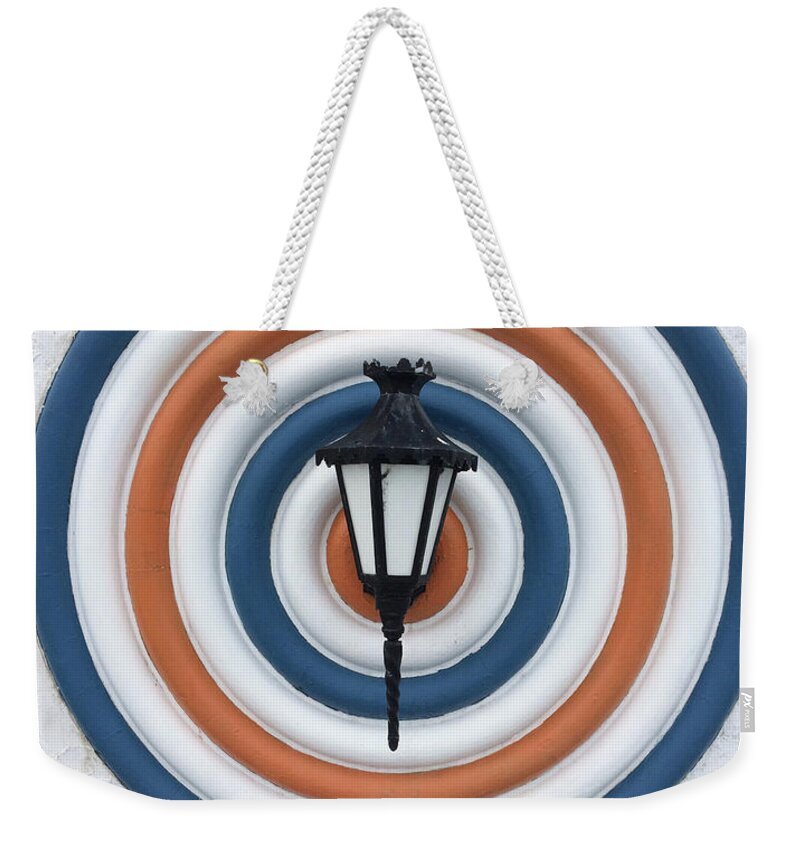 Light Weekender Tote Bag featuring the photograph Lamp hits the Bullseye by Matthew Wolf