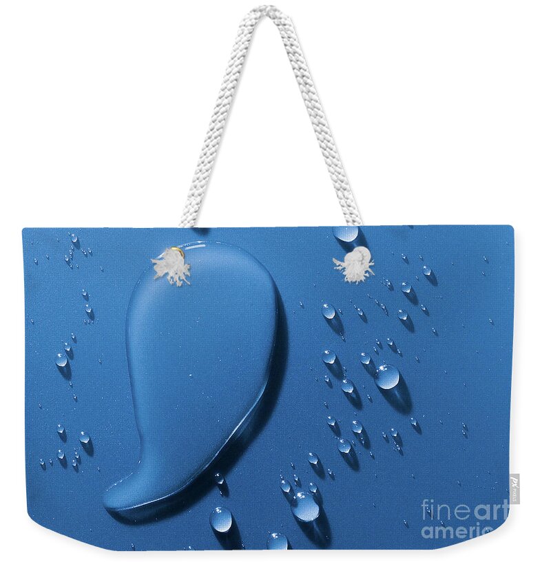 Water Weekender Tote Bag featuring the photograph Large and small water droplets viewed from above by Simon Bratt