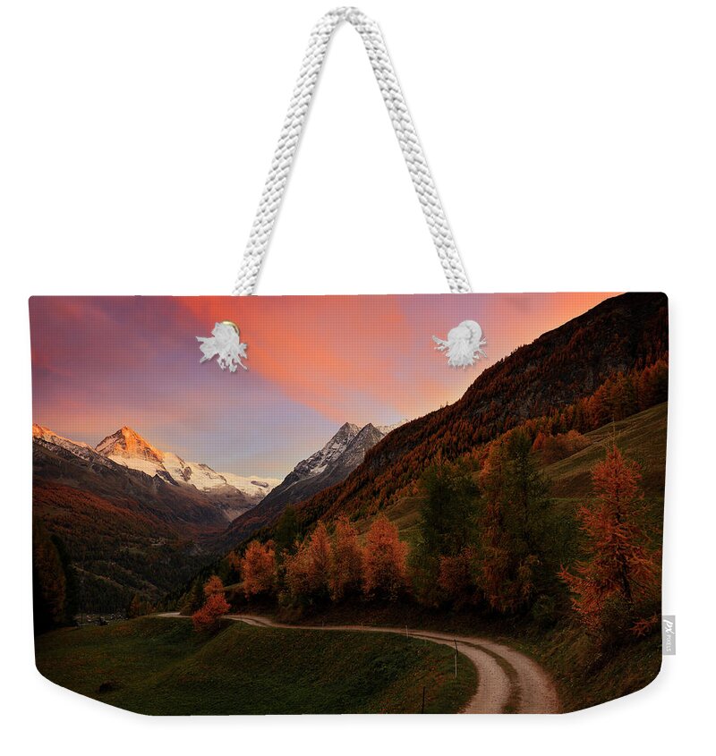 Alpine Weekender Tote Bag featuring the photograph Last illumination by Dominique Dubied