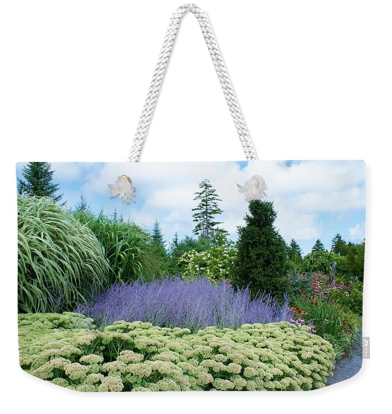 Gardens Weekender Tote Bag featuring the photograph Lavender in the middle by Lois Lepisto