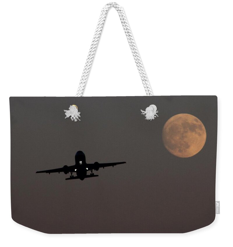 Airplane Weekender Tote Bag featuring the photograph Leaving On A Jet Plane by John Glass