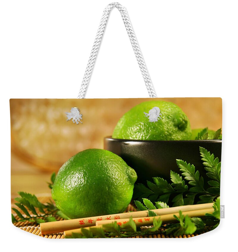 Lemon Weekender Tote Bag featuring the photograph Lemon by Mariel Mcmeeking