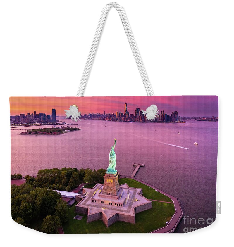America Weekender Tote Bag featuring the photograph Liberty Island Twilight by Inge Johnsson
