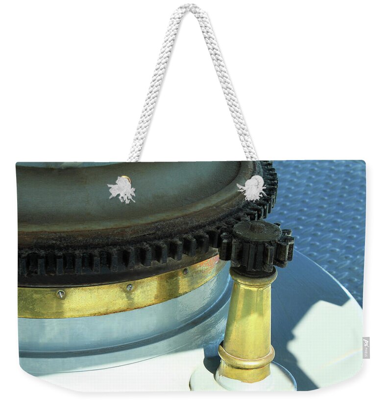 Gears Weekender Tote Bag featuring the photograph Lighthouse Lens Gears by James Eddy