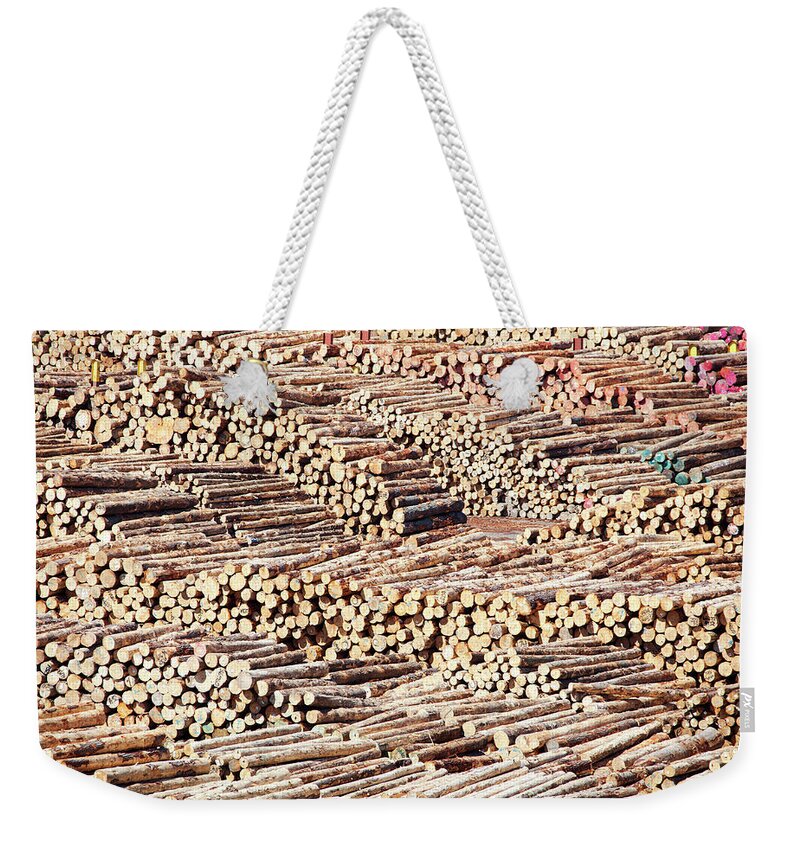 Logs Weekender Tote Bag featuring the photograph Logs by Ramunas Bruzas