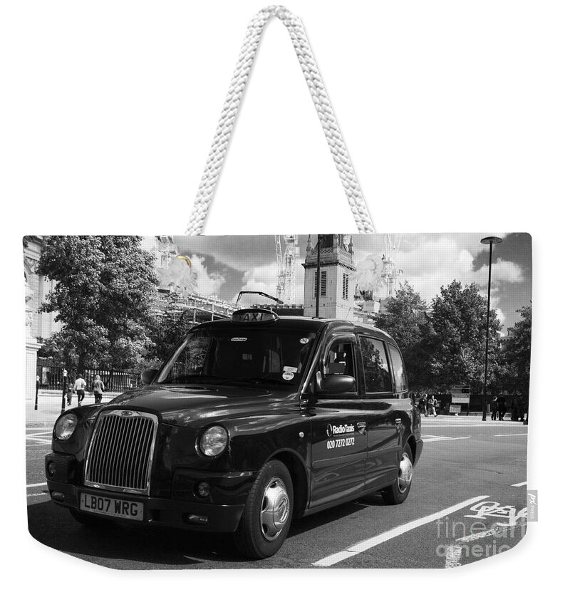 London Weekender Tote Bag featuring the photograph London Taxi by Agusti Pardo Rossello