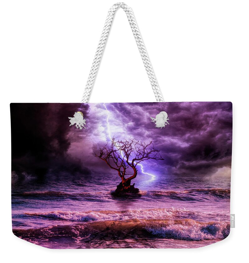 Lonely Tree Weekender Tote Bag featuring the photograph Lonely tree and the wild weather by Lilia S
