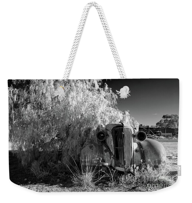 Broken Hill Nsw New South Wales Australian Old Car Pepper Tree Monochrome Mono B&w Black And White Weekender Tote Bag featuring the photograph Long Term Parking by Bill Robinson