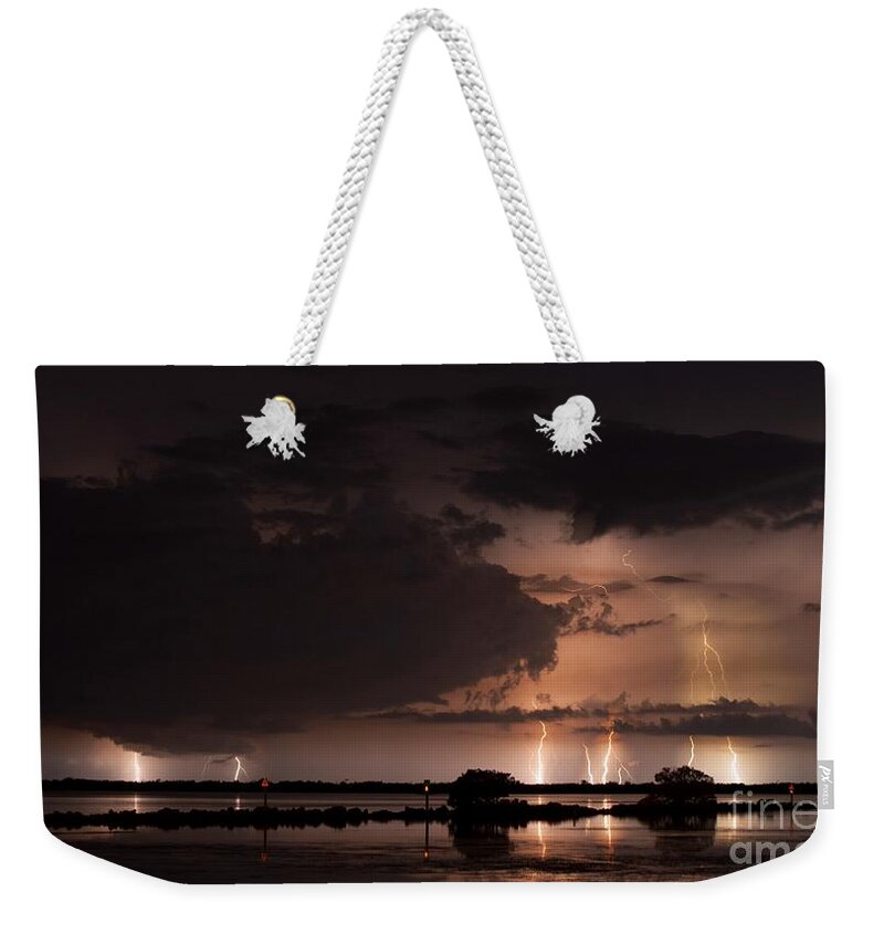 Lightning Weekender Tote Bag featuring the photograph Low Tide With High Energy by Quinn Sedam