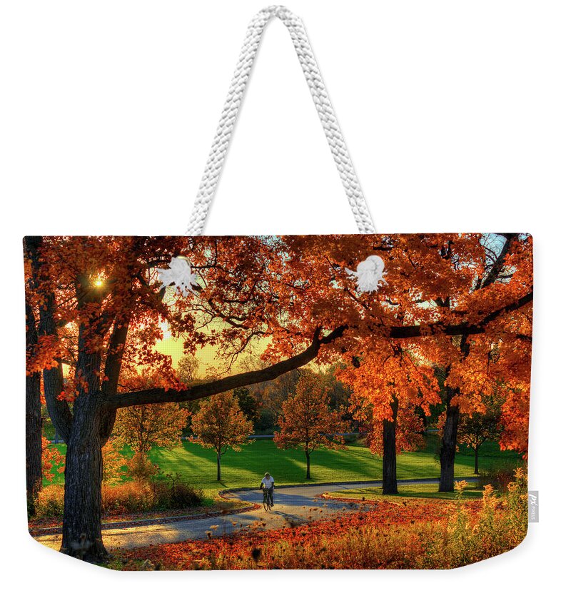Biking Bicycle Madison Wi Wisconsin Autumn Fall Fall Colors Orange Biker Weekender Tote Bag featuring the photograph Madison, Showing Off by Peter Herman